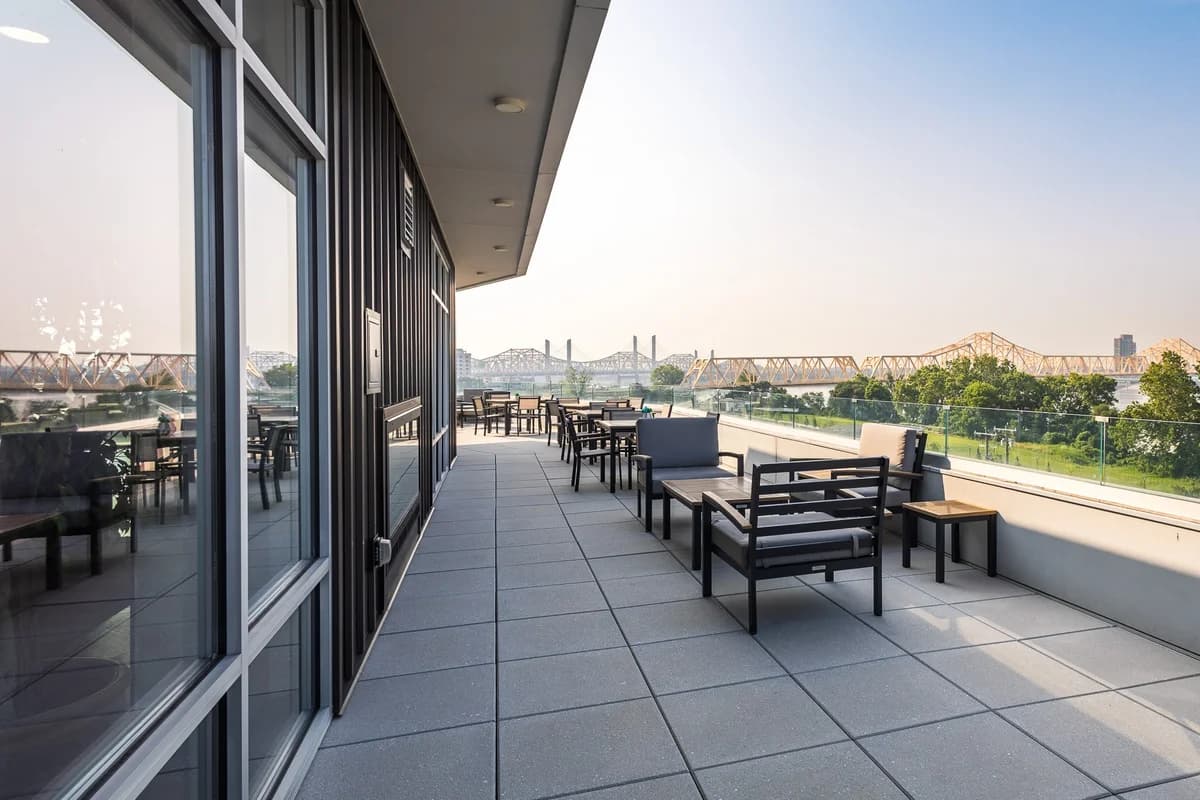 Louisville apartments for rent - image - Rooftop terrace with outdoor seating and bridge views