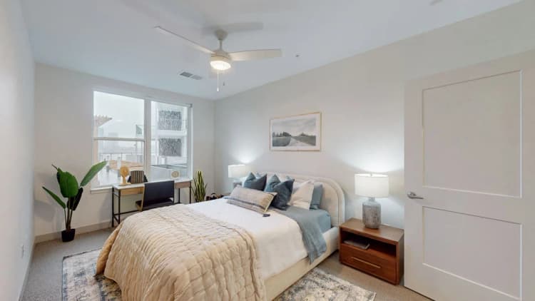 Louisville apartments for rent - image - Bedroom with ceiling fan and large windows