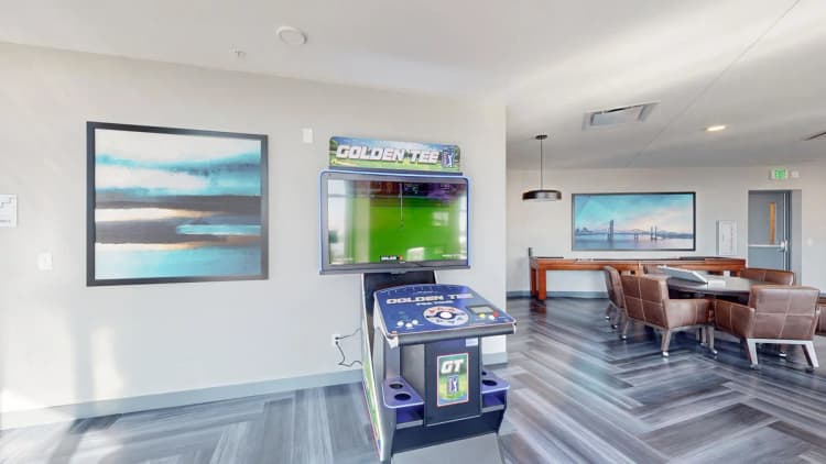 Louisville apartments for rent - image - Game room with arcade machine and lounge seating