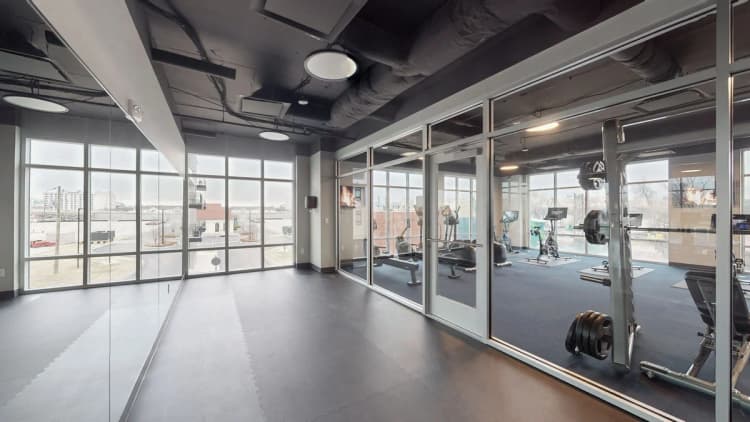 Louisville apartments for rent - image - Fitness center with glass walls and equipment