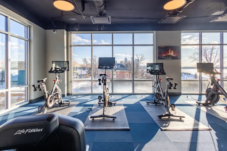 Louisville apartments for rent - image - Fitness center with spin bikes and large windows