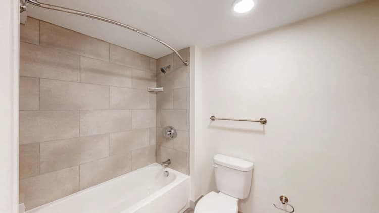 Louisville apartments for rent - image - Bathroom with tiled tub and shower combo