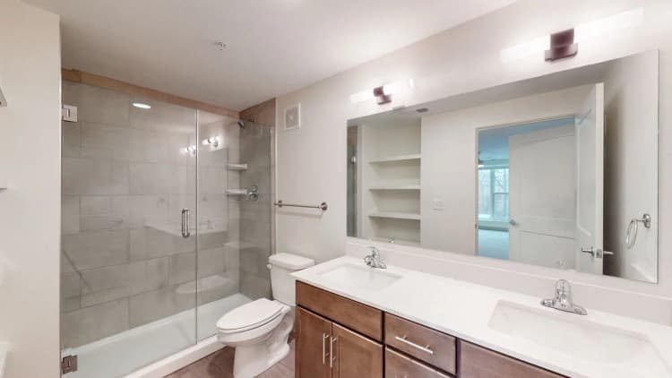 Louisville apartments for rent - image - Double vanity bathroom with glass shower enclosure